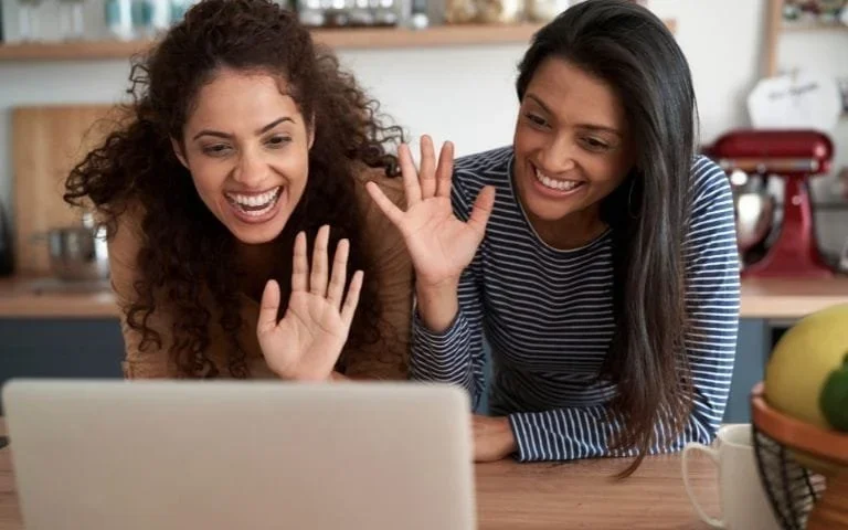 lesbian couple attending telehealth couples therapy