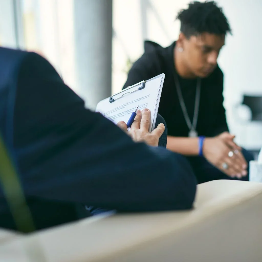 man receiving mental health assessment