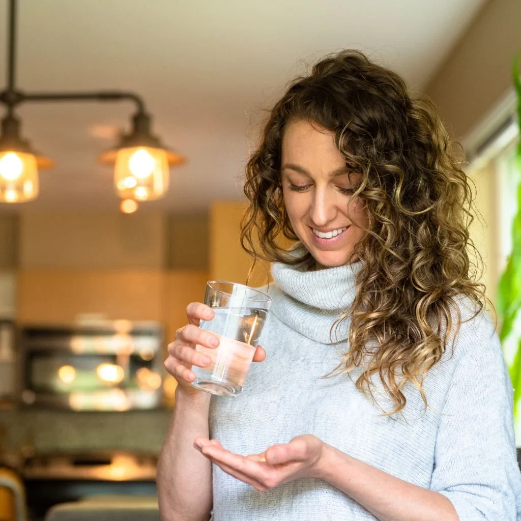 Woman taking supplements