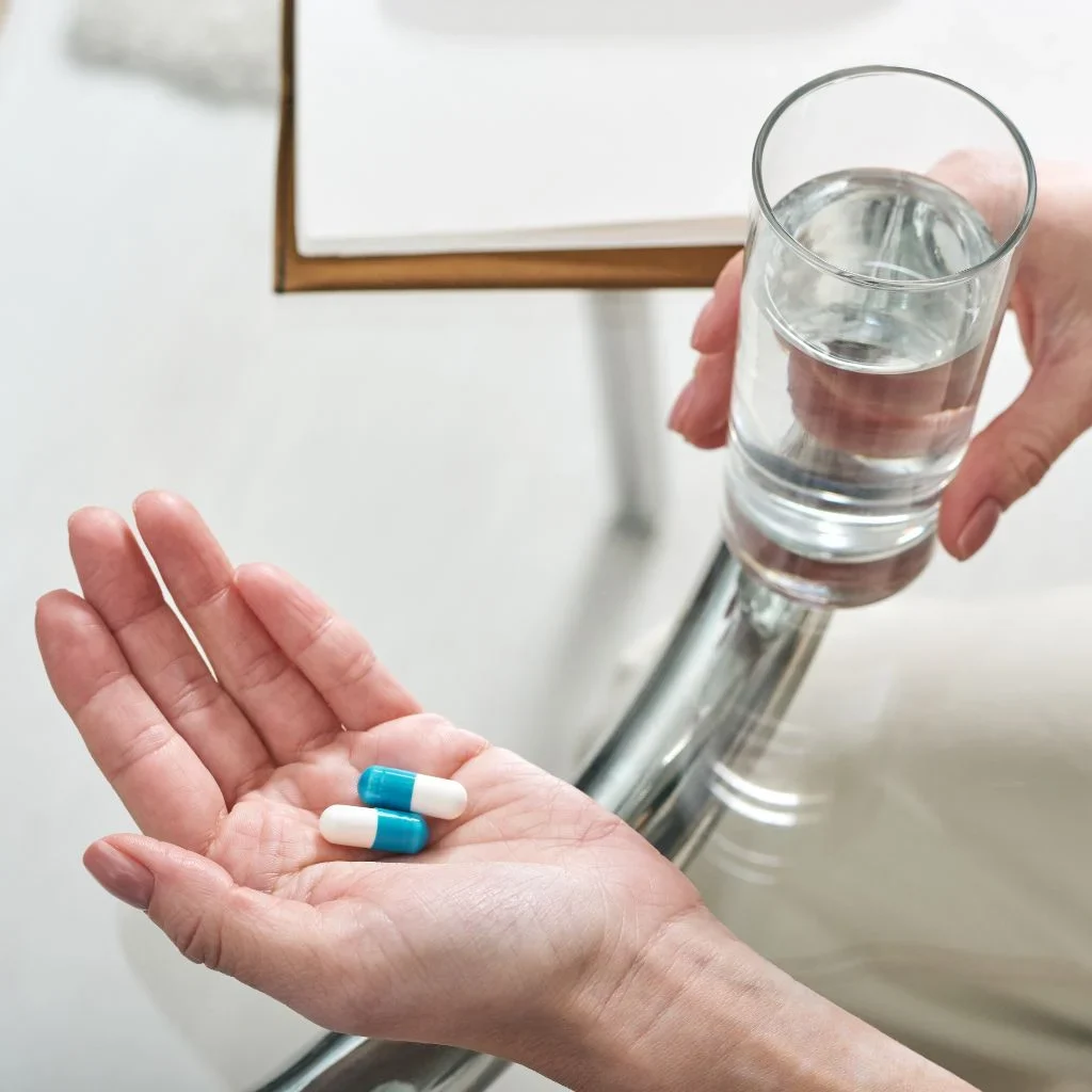 hand holding medication prescribed by a healthcare provider