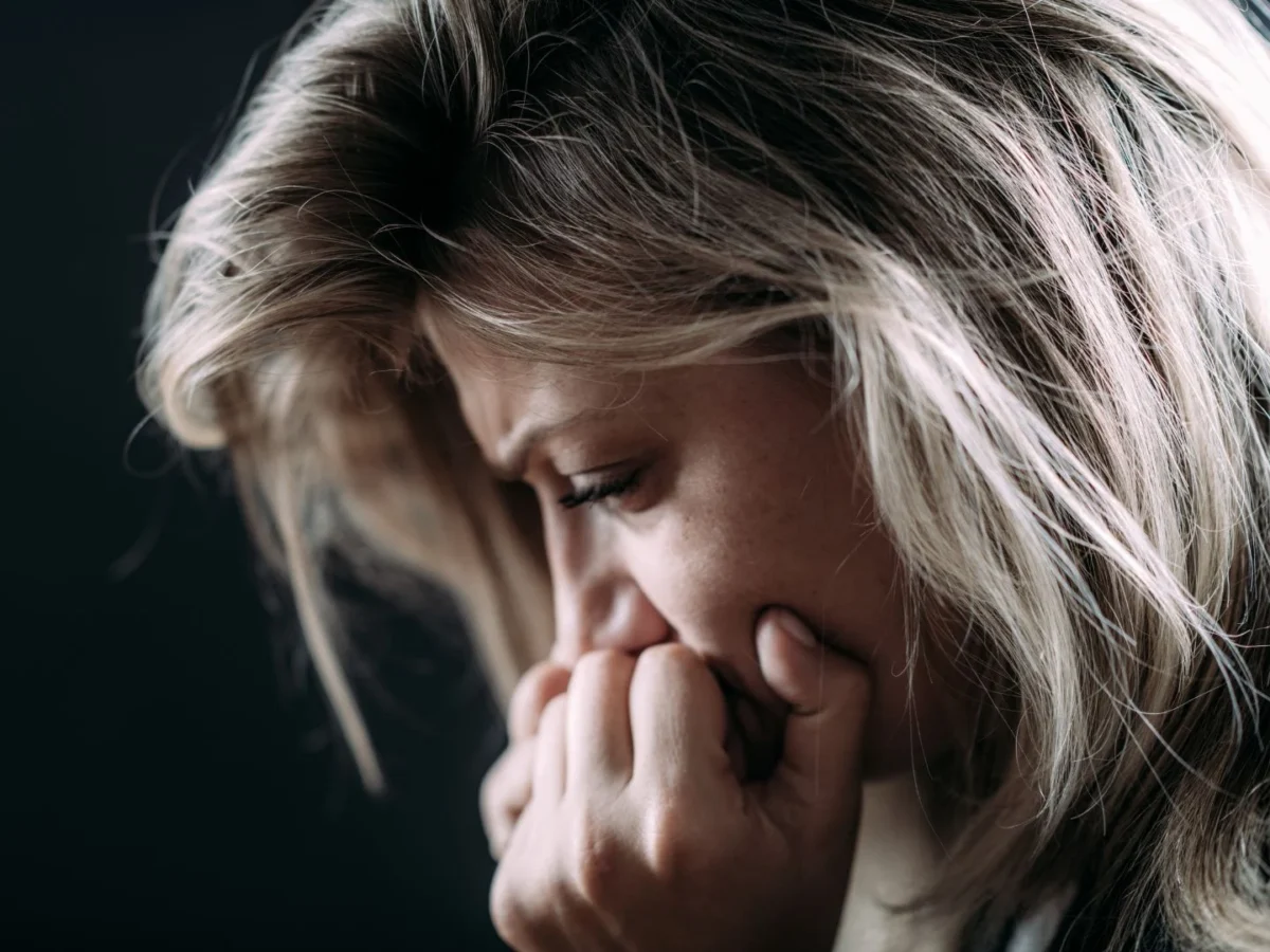Woman in deep contemplation and emotion