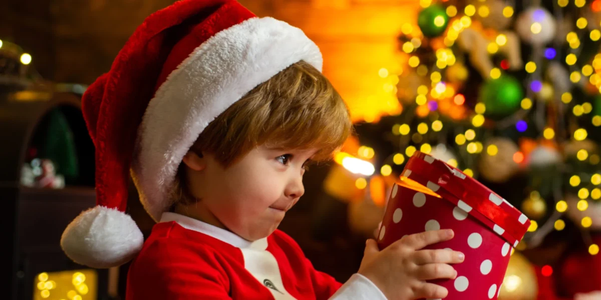 Child opening Christmas gift