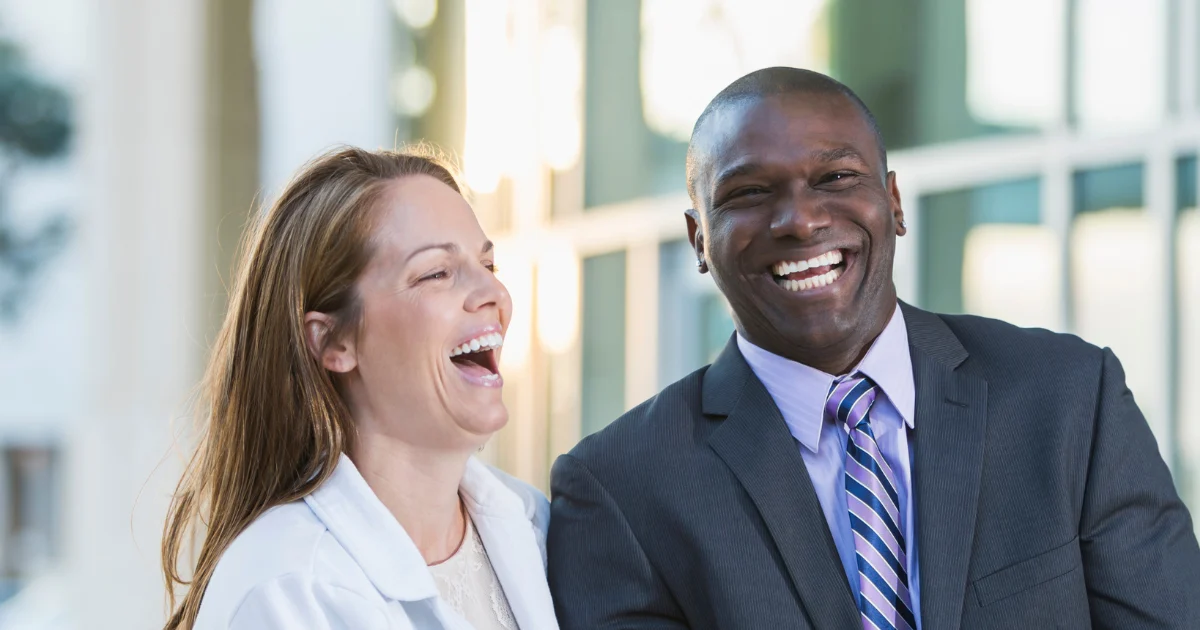Smiling Multiracial Couple Who Received Couples Counseling