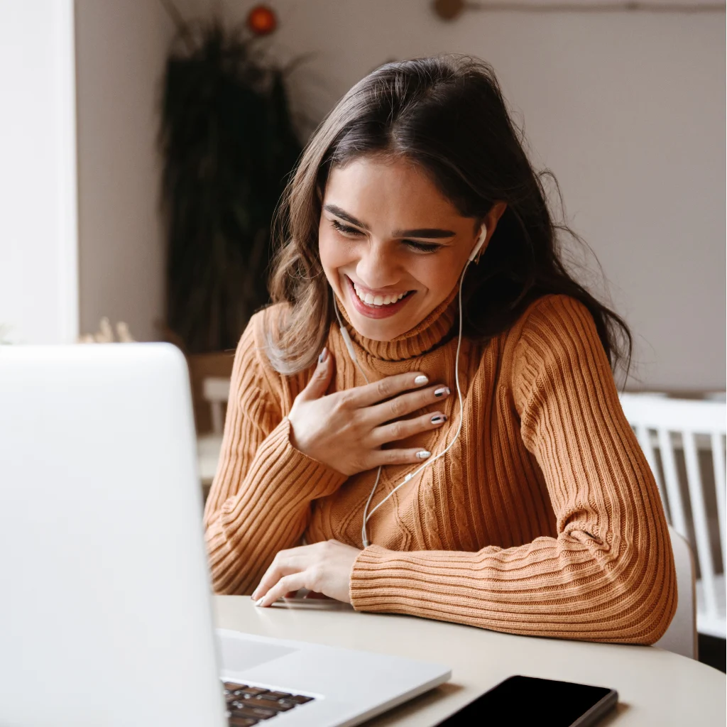 Woman smiling during telehealth counseling