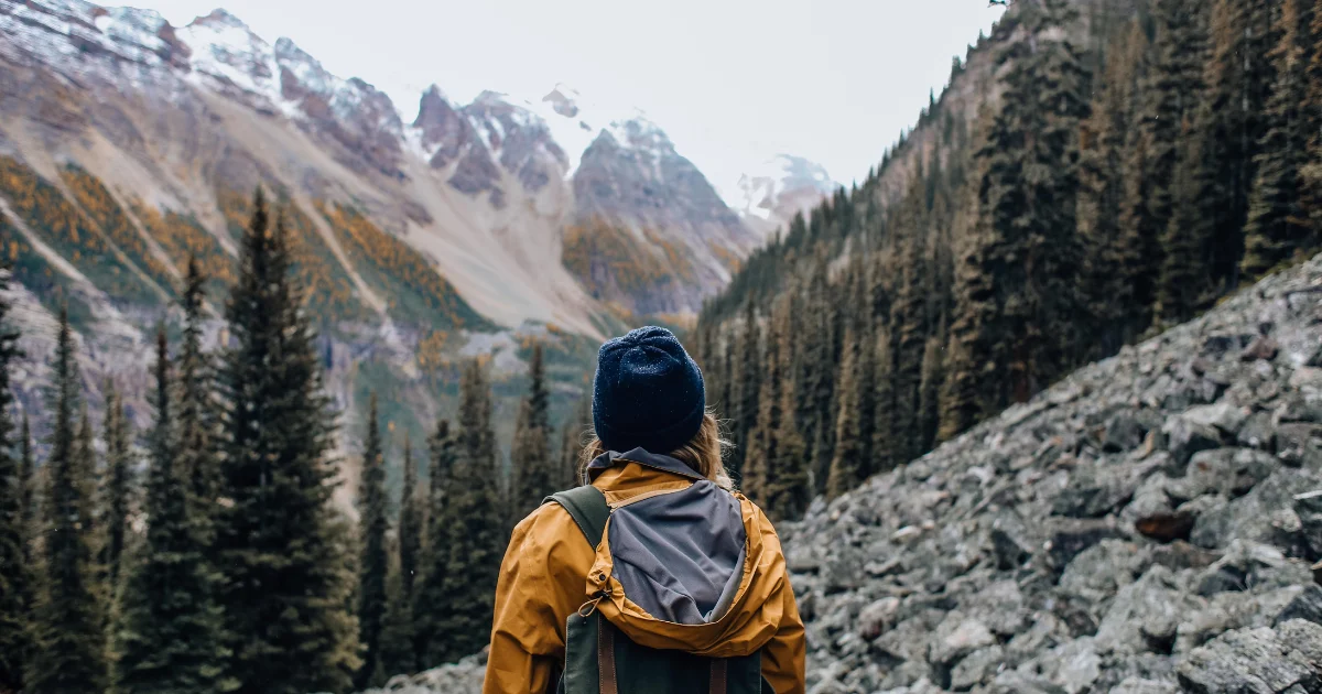 Woman hiking a trail finding a vantage point